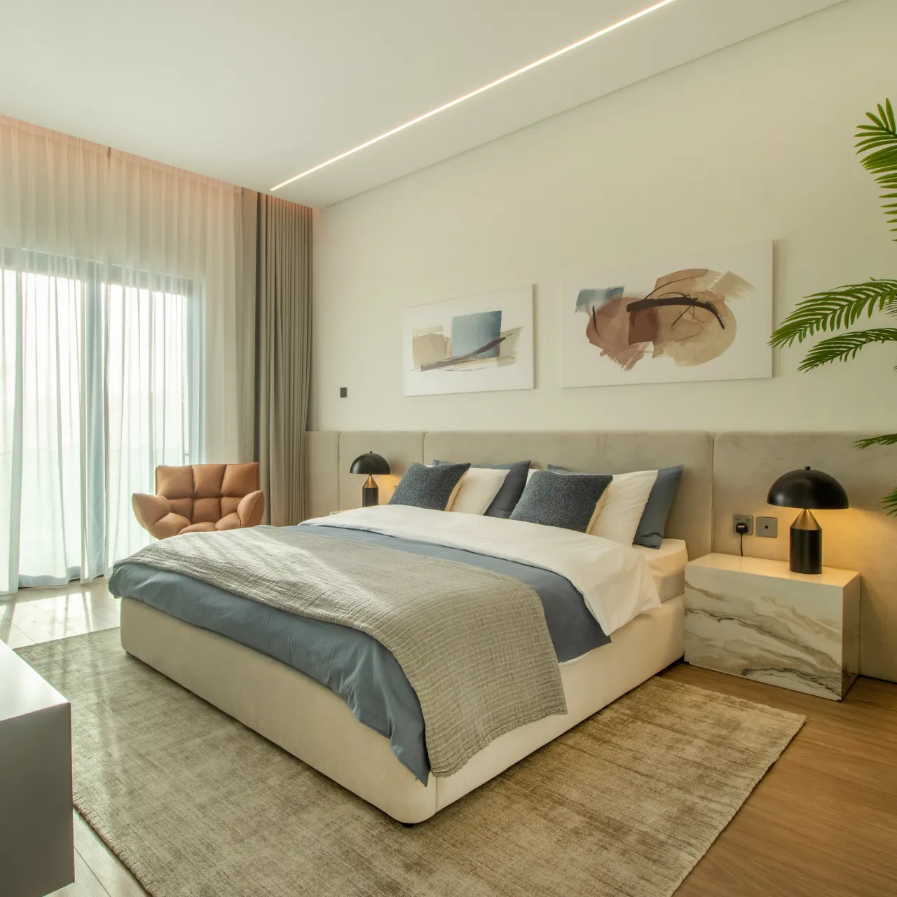 A bedroom with a king-size modern bed in a refurbishment project done by Arta in  Jumeirah Island Dubai