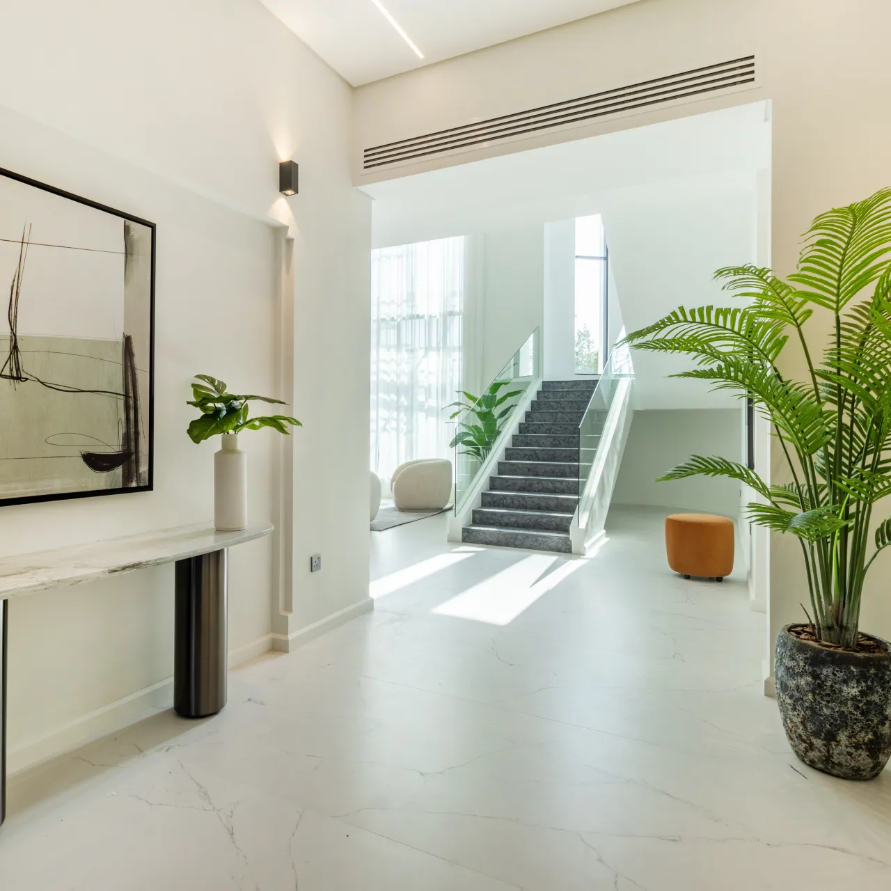 A complete house remodeling with living room, entrance and staircase layout changes in Jumeirah Islands