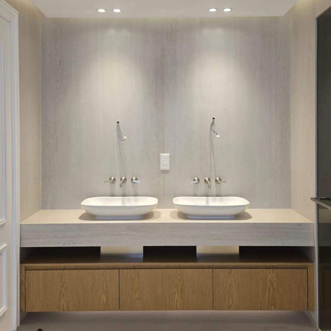 Bathroom refurbishment project in progress with a new custom vanity and travertine looking walls