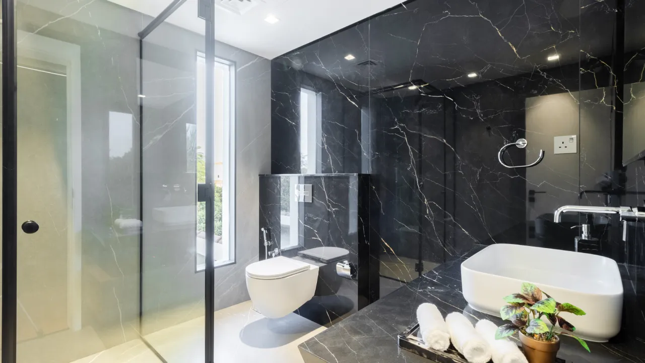 Upgraded black stone bathroom and glass shower Black stone bathroom and glass shower in a house in Dubai