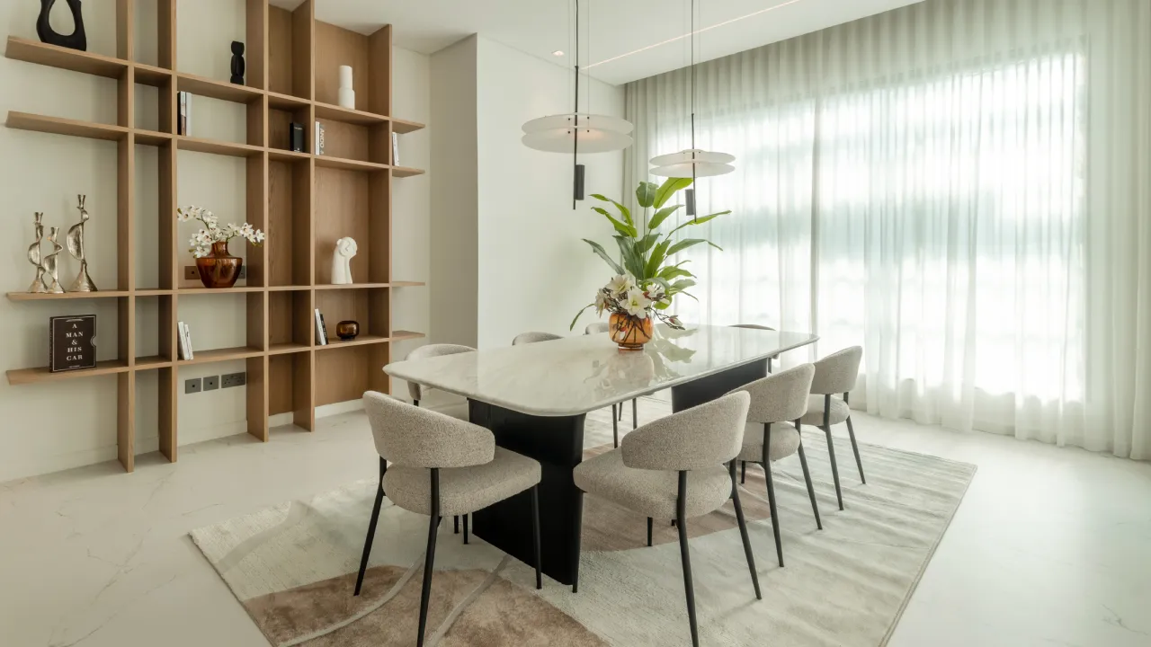 Jumeirah Islands home design with dining area and warm wood display shelving Modern Dubai home design with dining area and warm wood display shelving