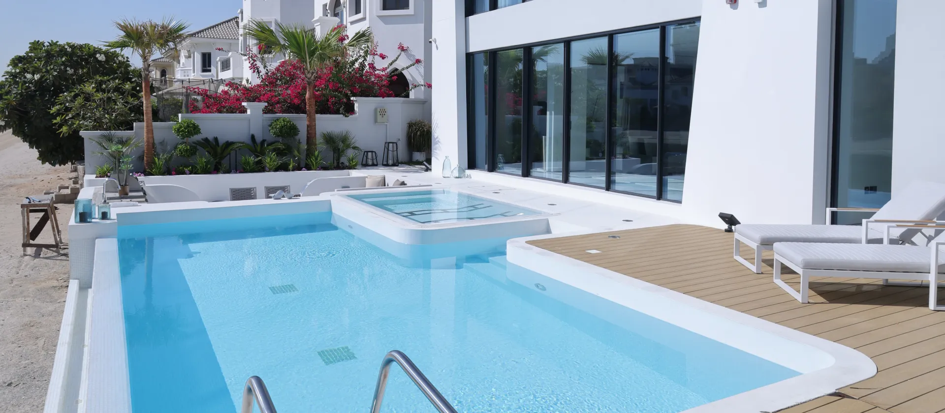 Palm Jumeirah villa after remodeling with a modern looking exterior design and an amazing swimming pool