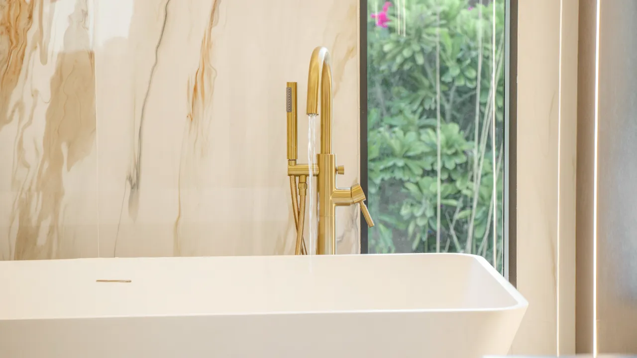 Villa renovation Jumeirah Islands bathroom with freestanding bathtub and brass fittings Master bathroom remodeling with freestanding bathtub and brass fittings